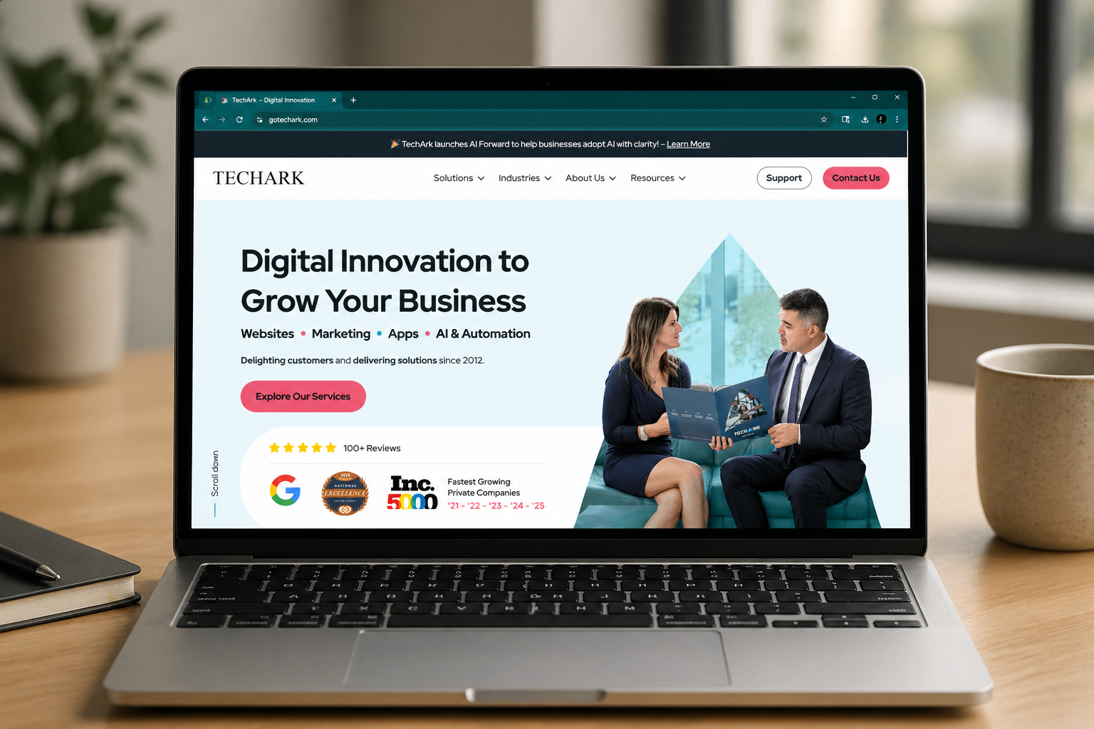 TechArk website preview on laptop